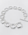 Stevige sterlingzilveren armband met gedurfde look en vierkante frameschakels met OT-gesp