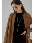 Minimalistische lange trui ketting met knoop