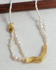 Zoetwaterparels ketting met gouden bedels