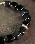 Zwarte obsidiaan blokken armband met bronzen armband